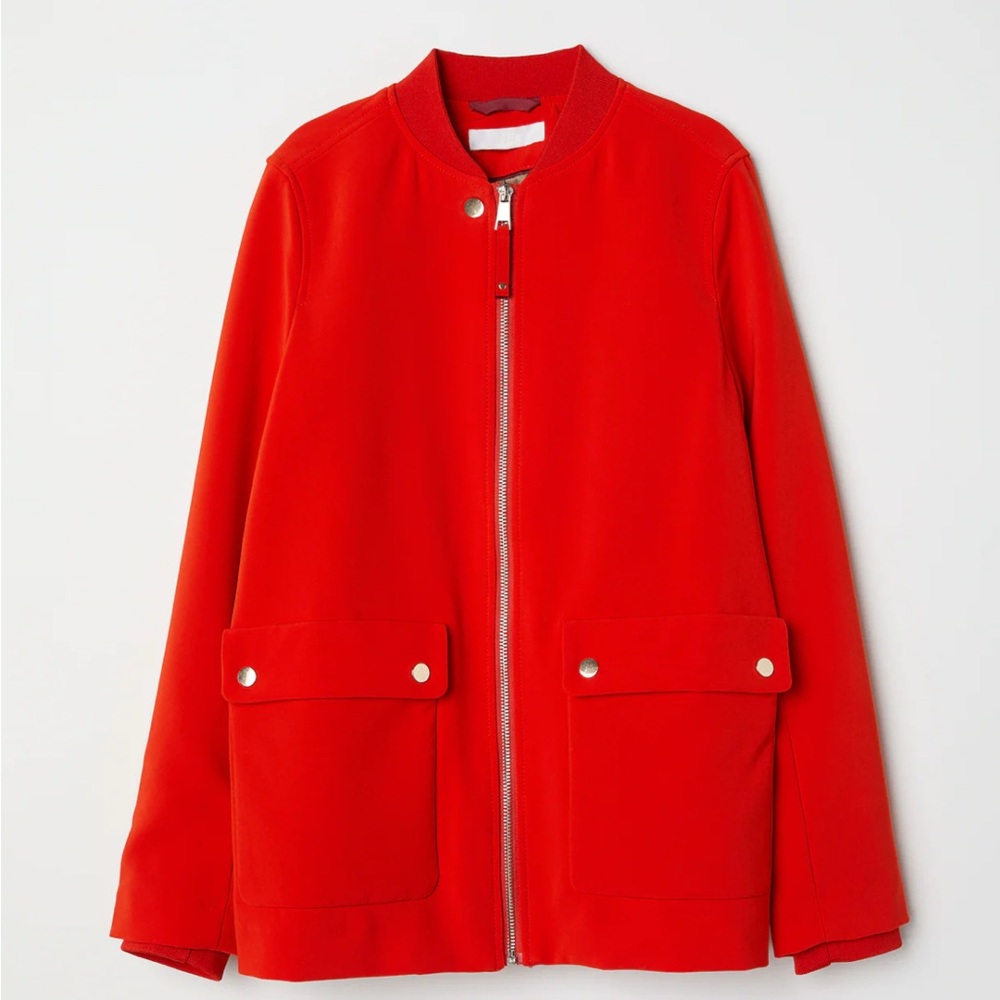Jacket in woven fabric with a small, ribbed stand-up collar.